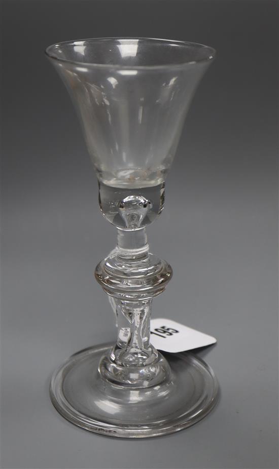 An early 18th century baluster wine glass, H 16cm